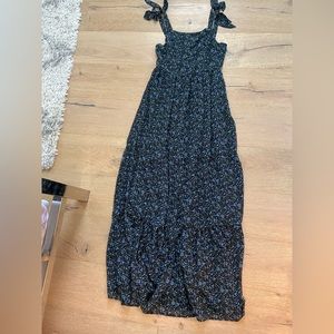 Long black maxi with tiny blue flowers on it.